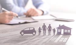 Image with arms and notebooks in background, with cutouts of a family, home and car in foreground.