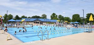 Pool at Champaign Park District with patrons in it.