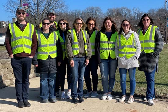 Safety Team members from St. Charles Park District wearing hi-visibility vests to demonstrate the importance of using them when working in parking lots and near roadways.